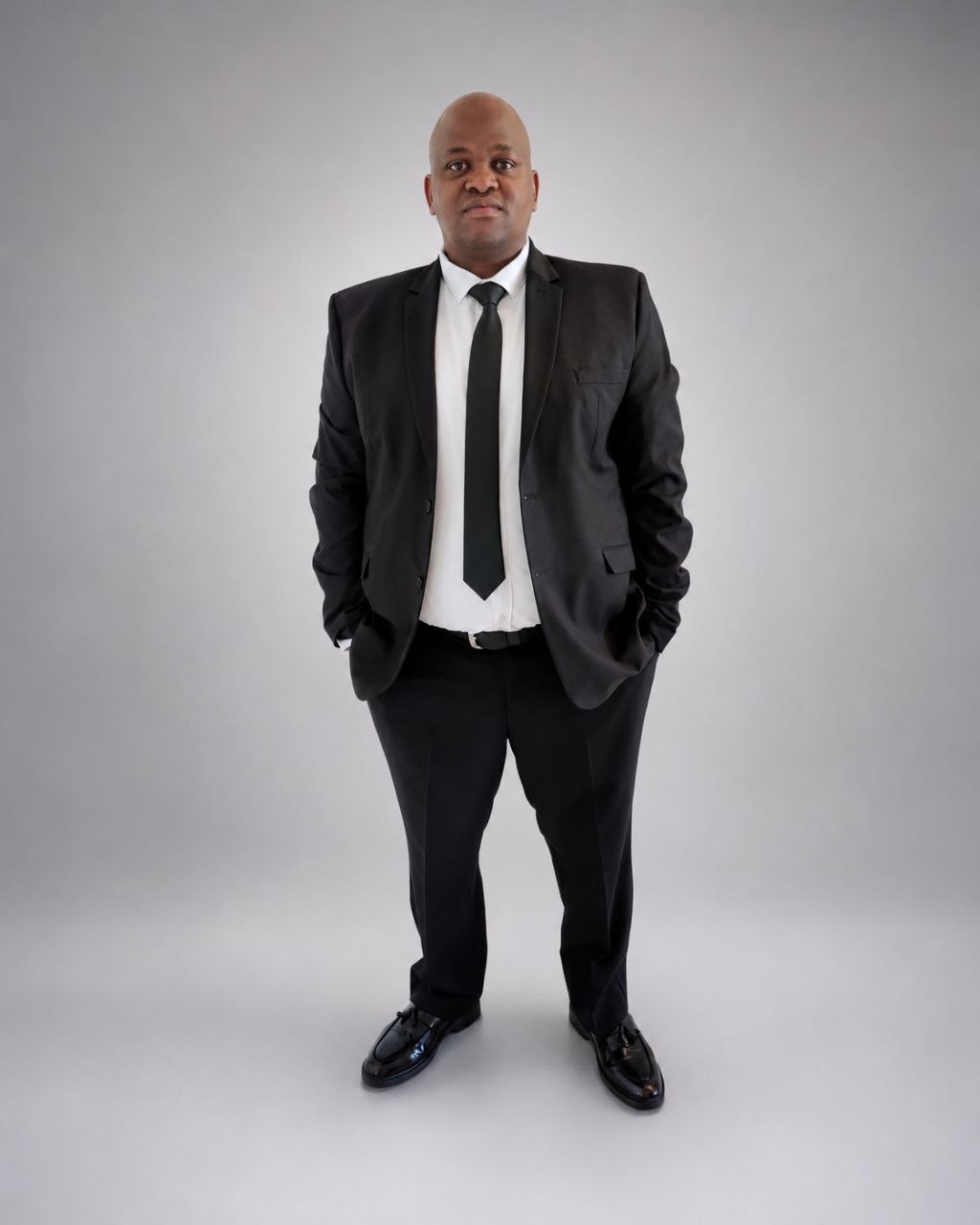 Flint Xolani Ntshangase in a black suit and tie